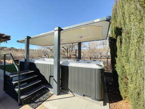 View of patio / terrace featuring a hot tub