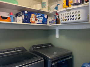 Great laundry room with a lot of built in storage.