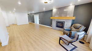 Sitting room featuring light hardwood / wood-style flooring and a fireplace