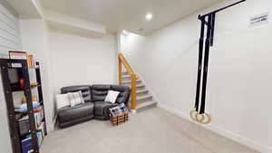 Sitting room featuring light colored carpet