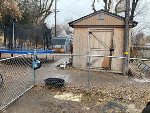 View of outbuilding with a trampoline