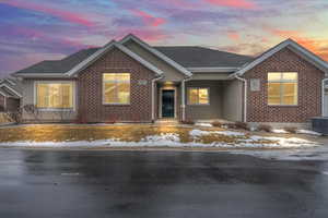 View of front of house with central AC