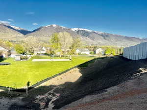 Property view of mountains with a residential view