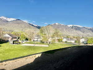 Property view of mountains with a residential view