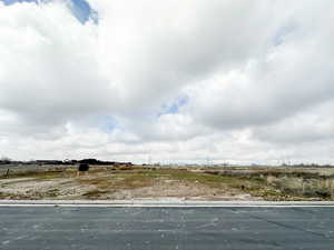 View of yard with a rural view