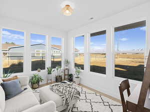 Sunroom featuring plenty of natural light