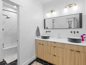 Bathroom 2 with tile patterned flooring, vanity, and bathtub / shower combination