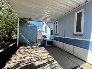 View of backyard patio / terrace with a storage shed