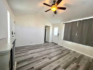 Interior space featuring light hardwood / wood-style flooring, ceiling fan, and vaulted ceiling