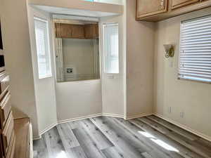 Interior space with cabinets and light hardwood / wood-style floors