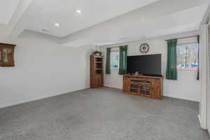 Unfurnished living room featuring carpet flooring