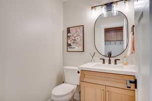 Bathroom featuring vanity and toilet