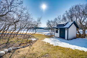 View of yard with a storage shed