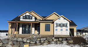 View of front of property featuring covered porch