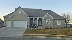 3-Car Garage, Bar Tile Roof and 100% Brick.