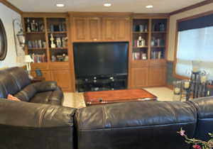 Living room featuring ornamental molding