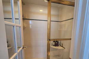 Bathroom with a shower with shower door