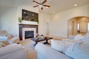 Living room with lofted ceiling and a fireplace