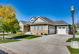 View of front facade featuring a garage