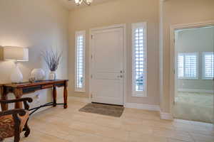 View of carpeted entrance foyer