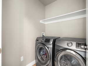 Laundry room featuring washing machine and dryer