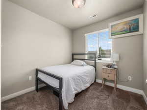 View of carpeted bedroom