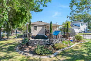 Back of house featuring a yard