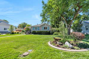 View of front of house featuring a front lawn