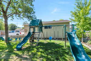 View of playground with a lawn