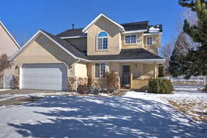 Front of property featuring a garage and a porch