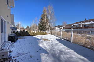 View of yard covered in snow