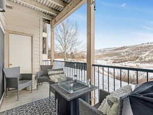 View of snow covered back of property