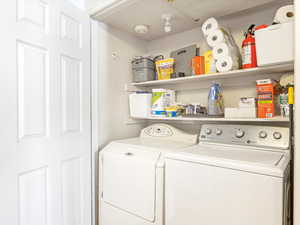 Washroom featuring independent washer and dryer