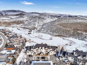 Snowy aerial view with a mountain view