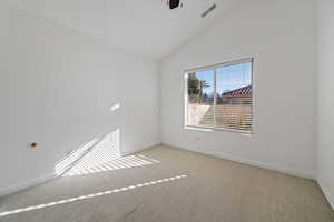 Unfurnished room featuring light carpet, high vaulted ceiling, and ceiling fan