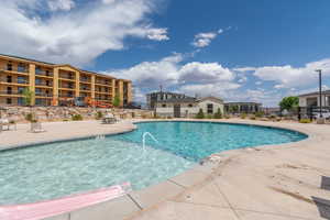 Community pool featuring a patio area