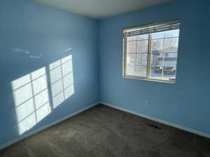 View of carpeted spare room