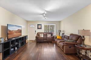 Living room featuring dark hardwood / wood-style floors