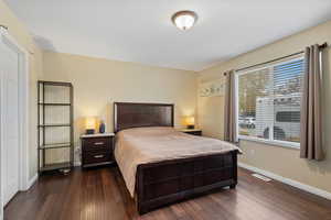 Bedroom featuring dark wood-type flooring