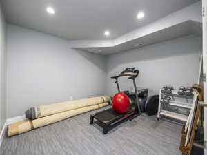 Workout area featuring hardwood / wood-style floors