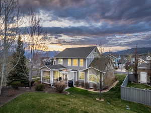 Exterior space with a mountain view and a lawn