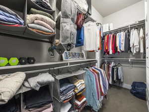 Spacious closet with carpet floors