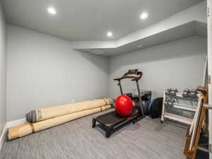 Workout room featuring hardwood / wood-style floors