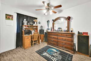 Office area featuring ceiling fan and carpet