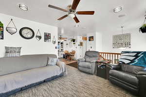 Living room featuring ceiling fan