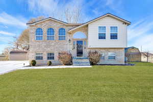 View of front of home featuring a front lawn