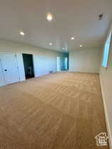 Basement with light carpet