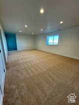 Basement featuring carpet