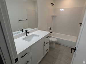 Full bathroom with vanity, toilet, and tub / shower combination