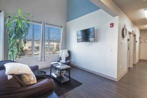 Living room with dark hardwood / wood-style floors